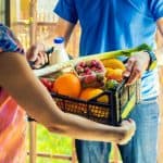 Blog 2 woman accepting groceries box